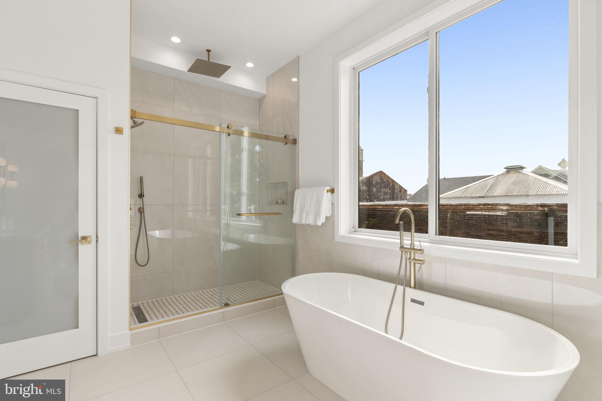 503 Winton Street Philadelphia, PA 19148 - Photo 46 of 65 a bathroom with a bathtub and a shower