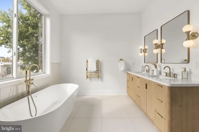 a bathroom with a toilet a sink and shower