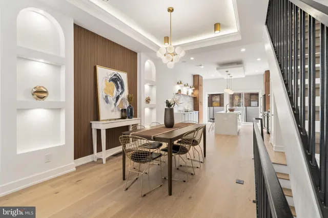 a view of a livingroom with furniture and a floor to ceiling window