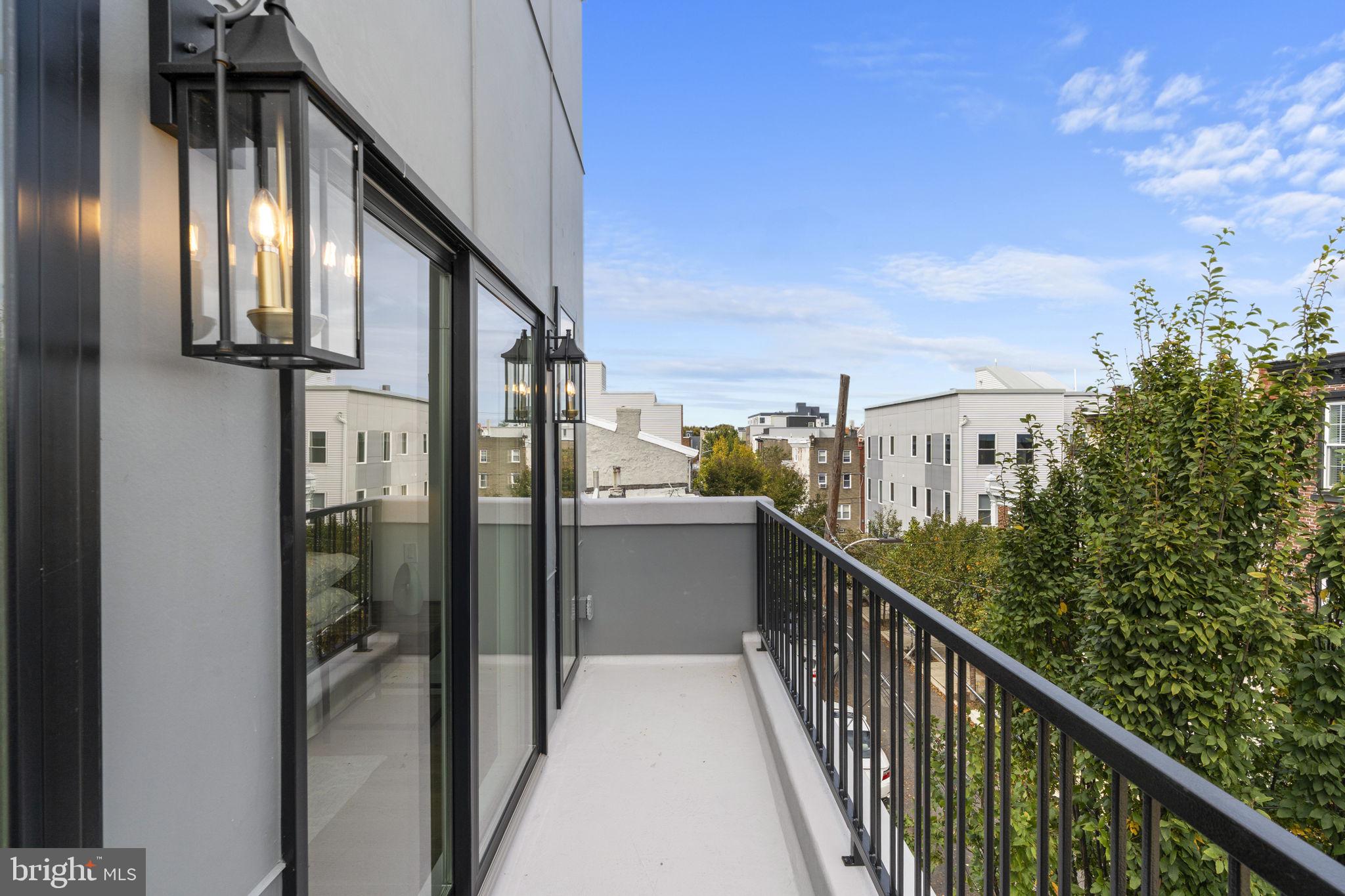 503 Winton Street Philadelphia, PA 19148 - Photo 51 of 65 a view of a balcony with wooden floor and stairs