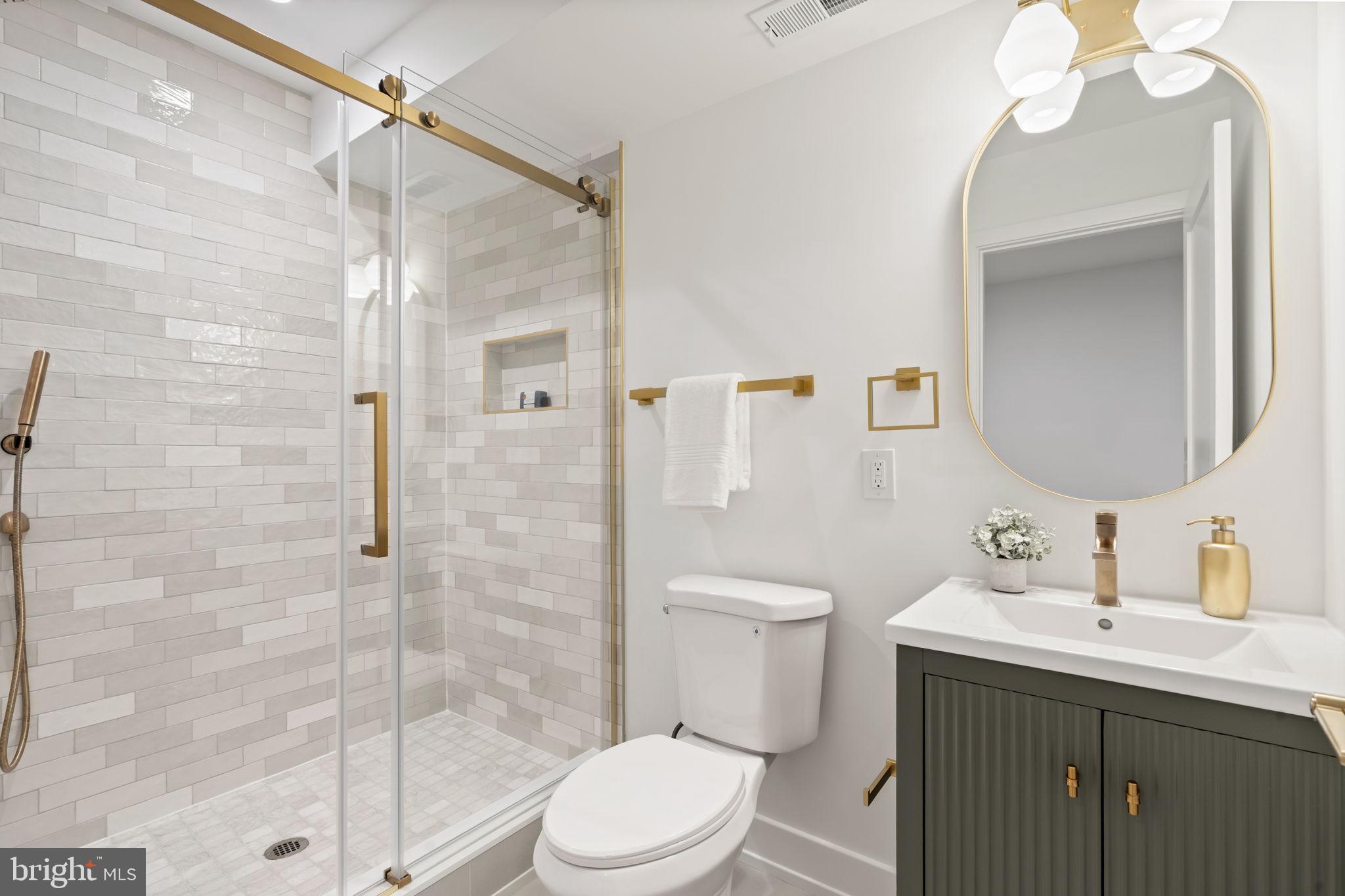 503 Winton Street Philadelphia, PA 19148 - Photo 61 of 65 a bathroom with a toilet a sink and shower