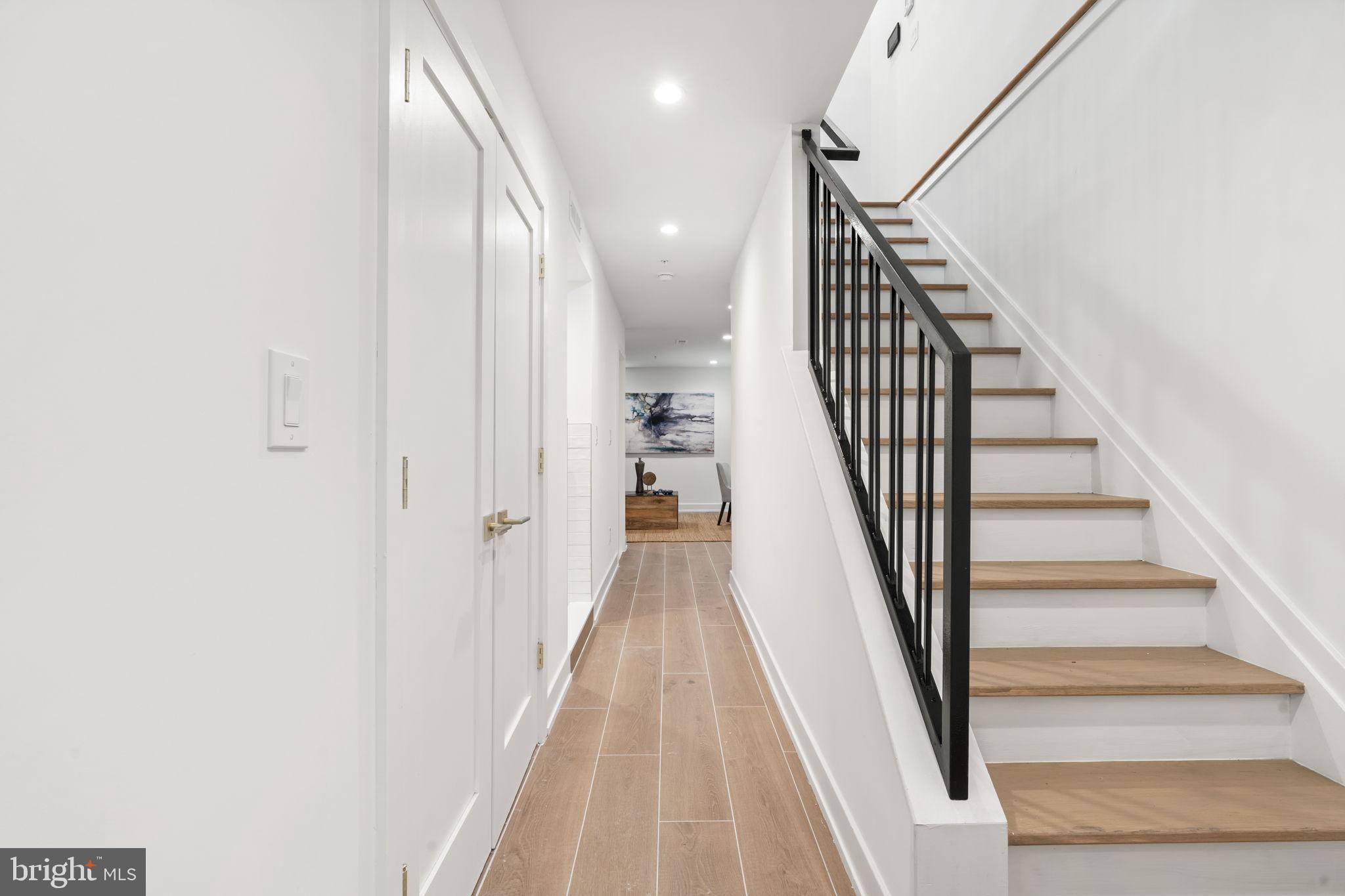 503 Winton Street Philadelphia, PA 19148 - Photo 62 of 65 a view of a hallway with wooden floor and entryway