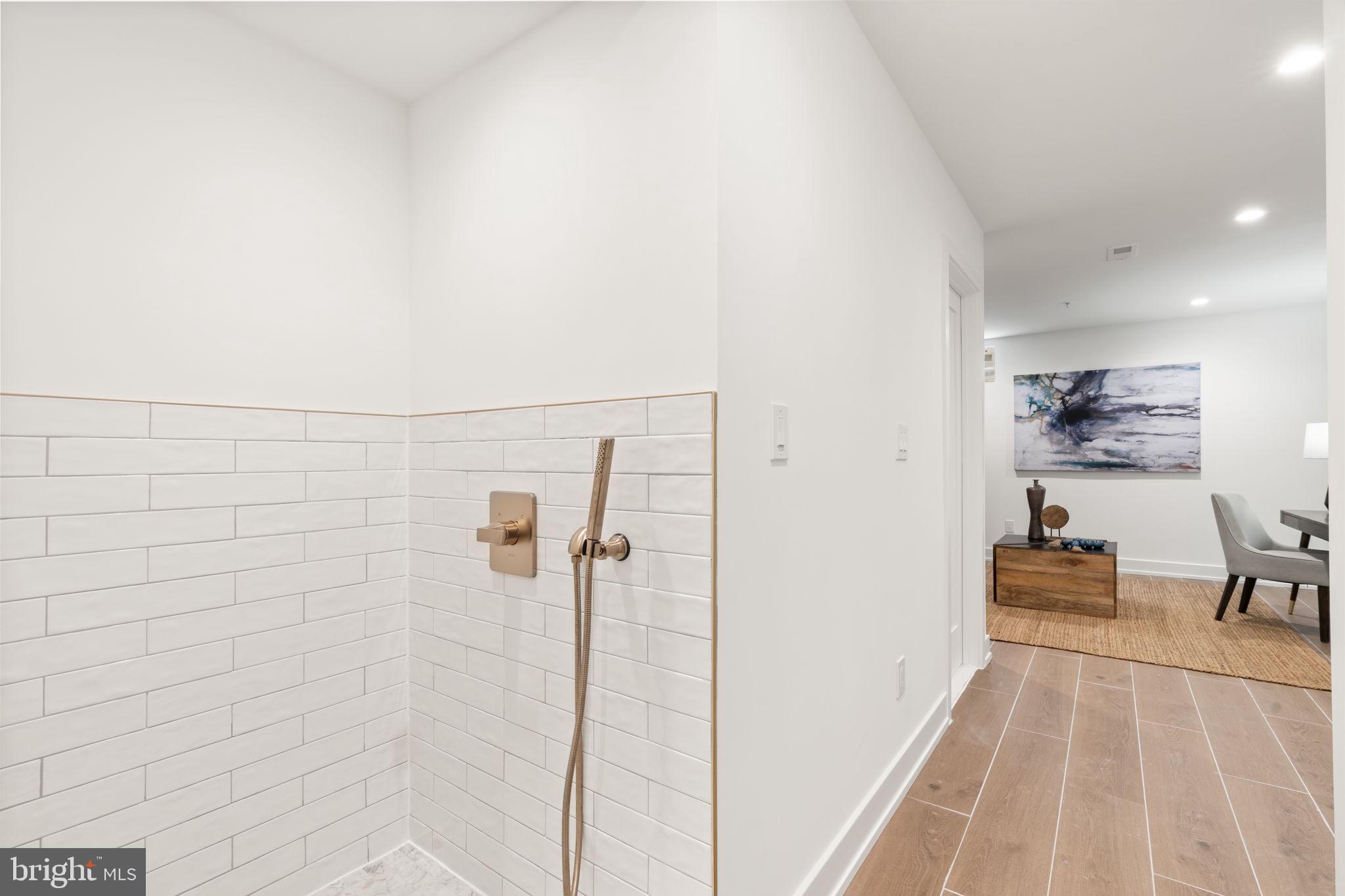 503 Winton Street Philadelphia, PA 19148 - Photo 63 of 65 a bathroom with a sink and a shower