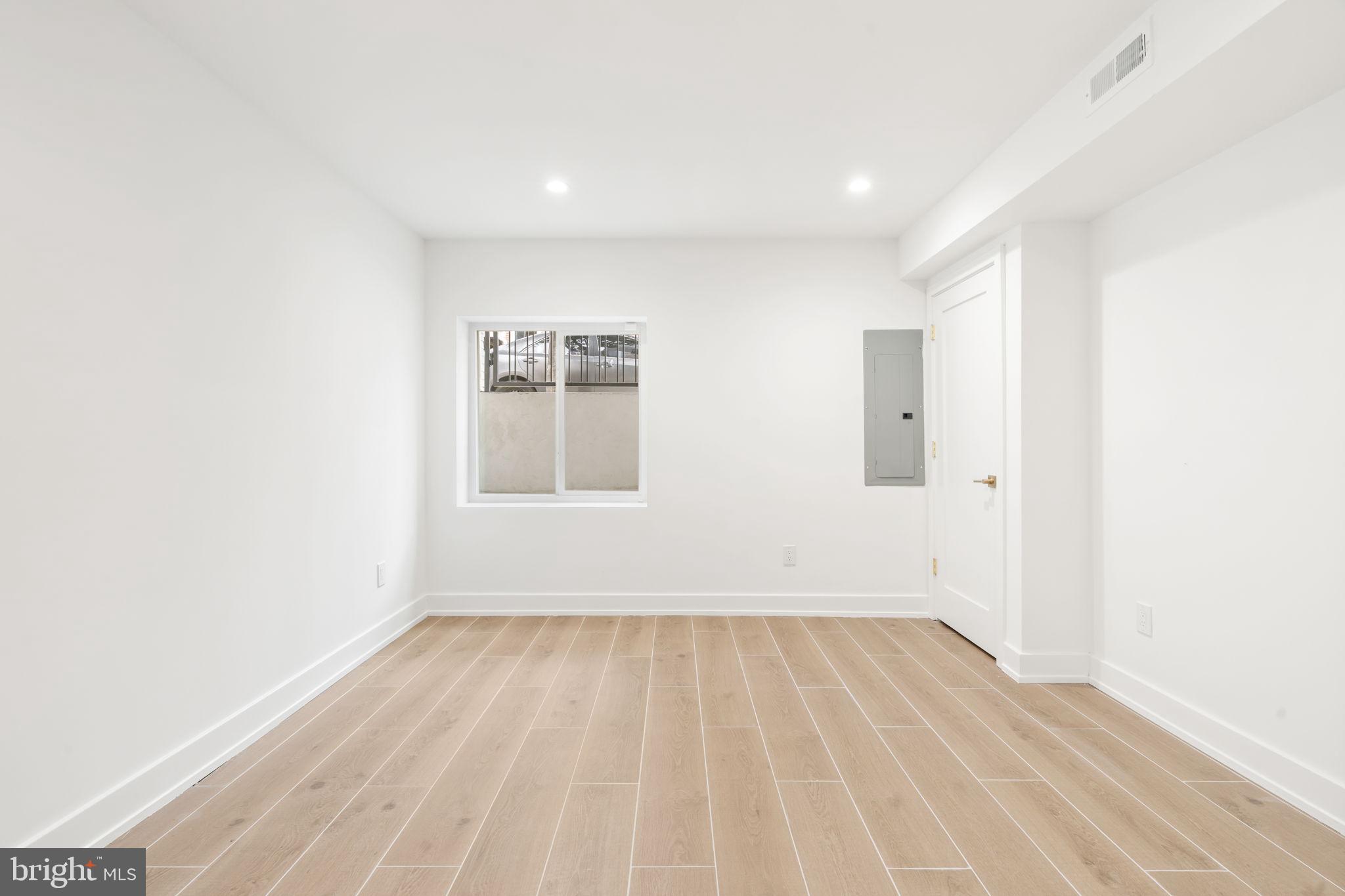 503 Winton Street Philadelphia, PA 19148 - Photo 65 of 65 a view of room with window and wooden floor