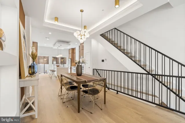 a view of a livingroom with furniture and stairs