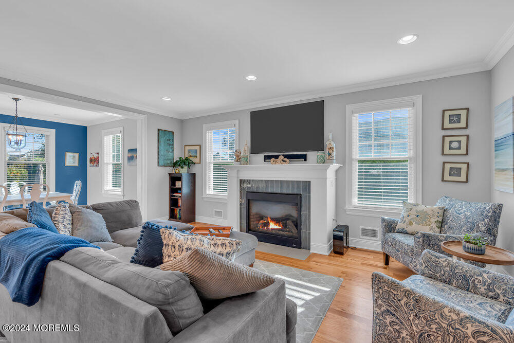 300 Salem Avenue Spring Lake, NJ 07762 - Photo 17 of 52 a living room with furniture a flat screen tv and a fireplace