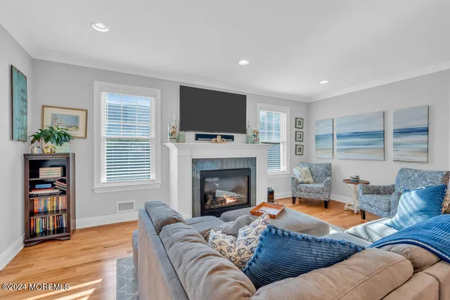 a living room with furniture fireplace and flat screen tv
