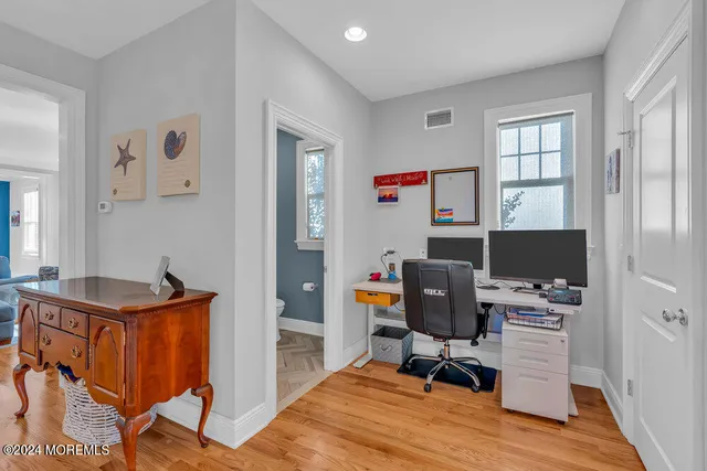 a workspace with furniture and window