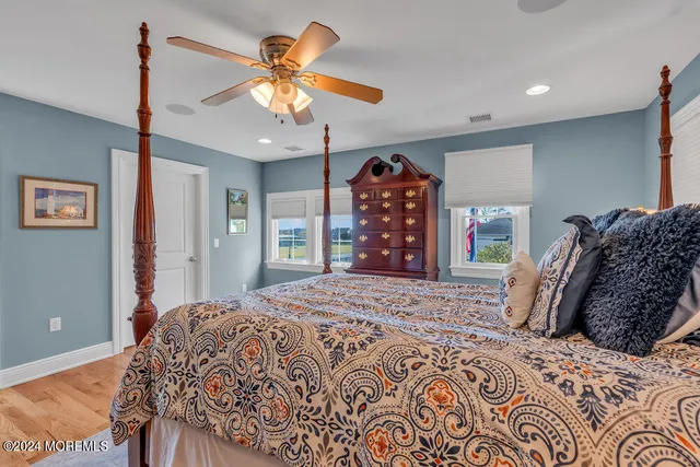 a bedroom with a bed dresser and a window