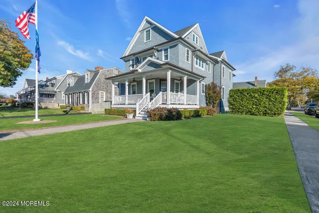 a front view of a house with a yard table and chairs