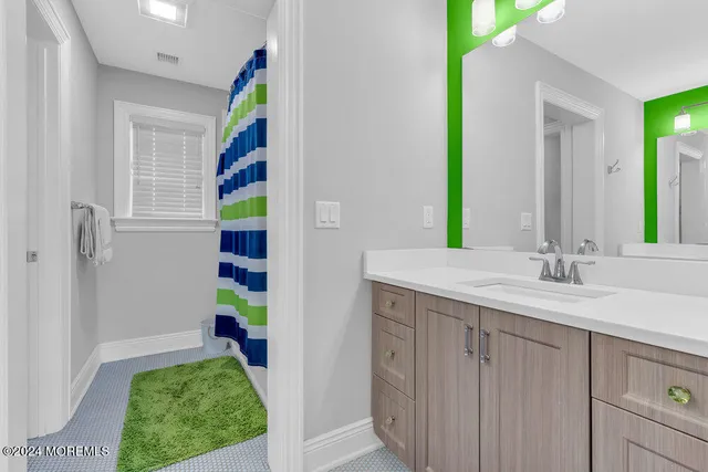 a bathroom with a sink a vanity and a mirror