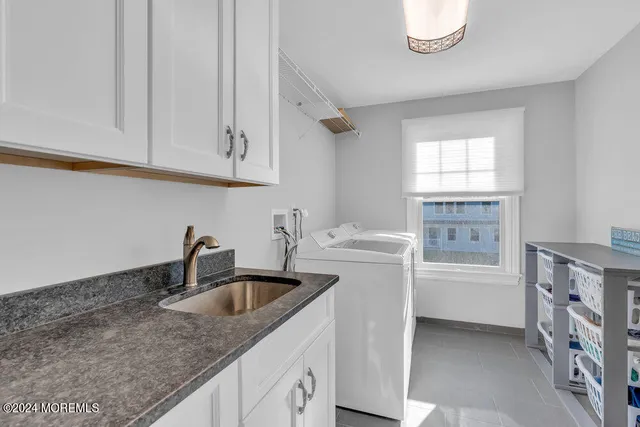 a kitchen with a sink and cabinets