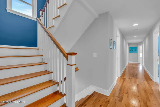 a living room with a couch and a dresser