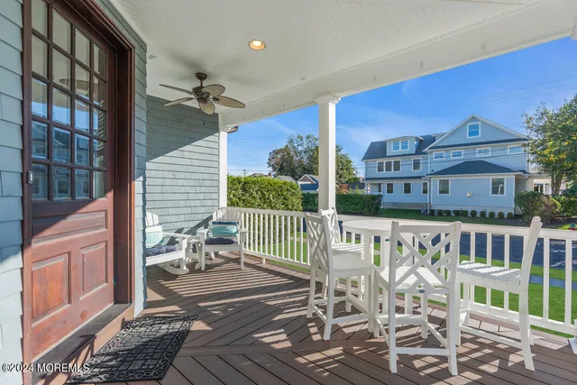 a balcony with table and chairs