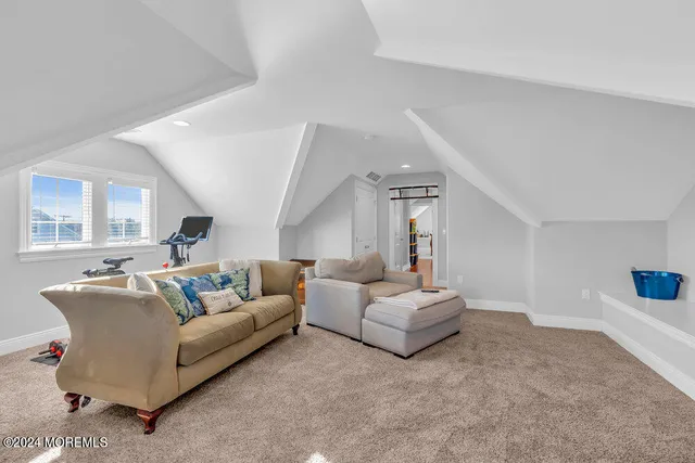 a view of a backyard with sitting area