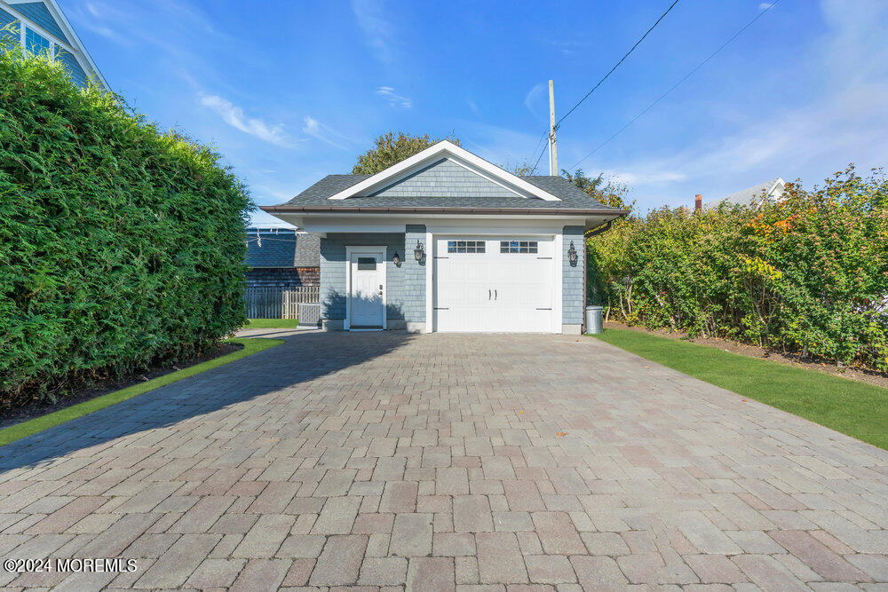300 Salem Avenue Spring Lake, NJ 07762 - Photo 48 of 52 a front view of a house with a yard and garage