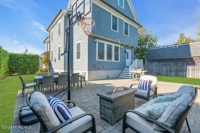 a view of a patio with couches table and chairs