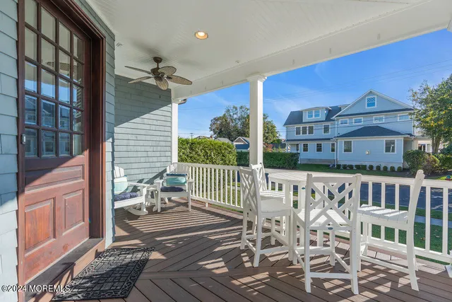 a balcony view with a seating space