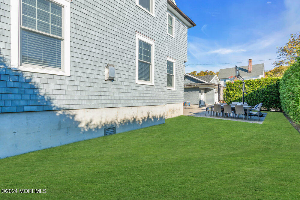 300 Salem Avenue Spring Lake, NJ 07762 - Photo 51 of 52 a backyard of a house with table and chairs