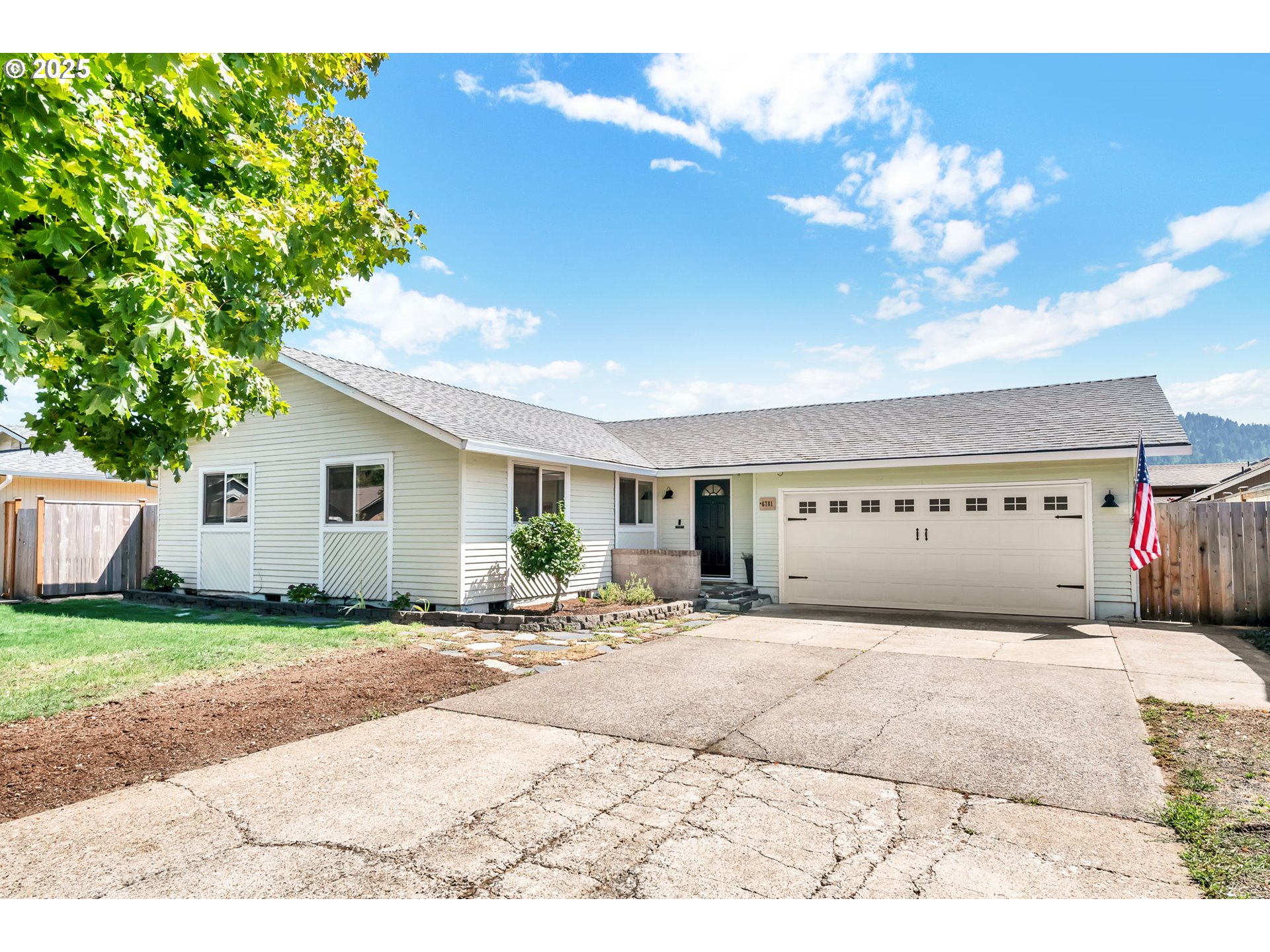 6781 F Street Springfield, OR 97478 - Photo 1 of 48 a view of a house with a outdoor space