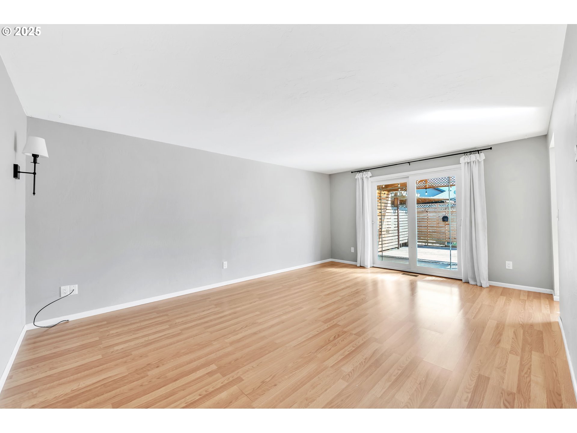 6781 F Street Springfield, OR 97478 - Photo 20 of 48 a view of an empty room and wooden floor