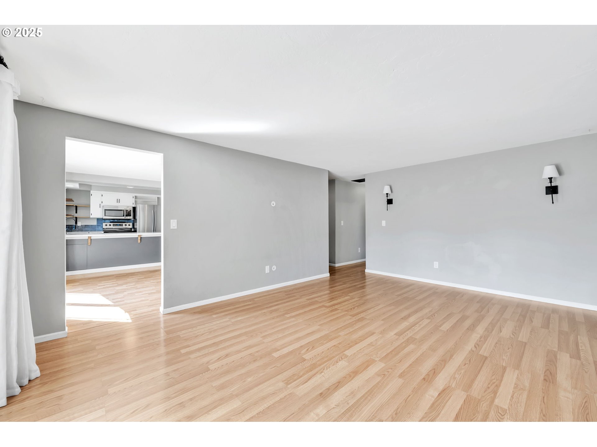 6781 F Street Springfield, OR 97478 - Photo 22 of 48 a view of an empty room and wooden floor