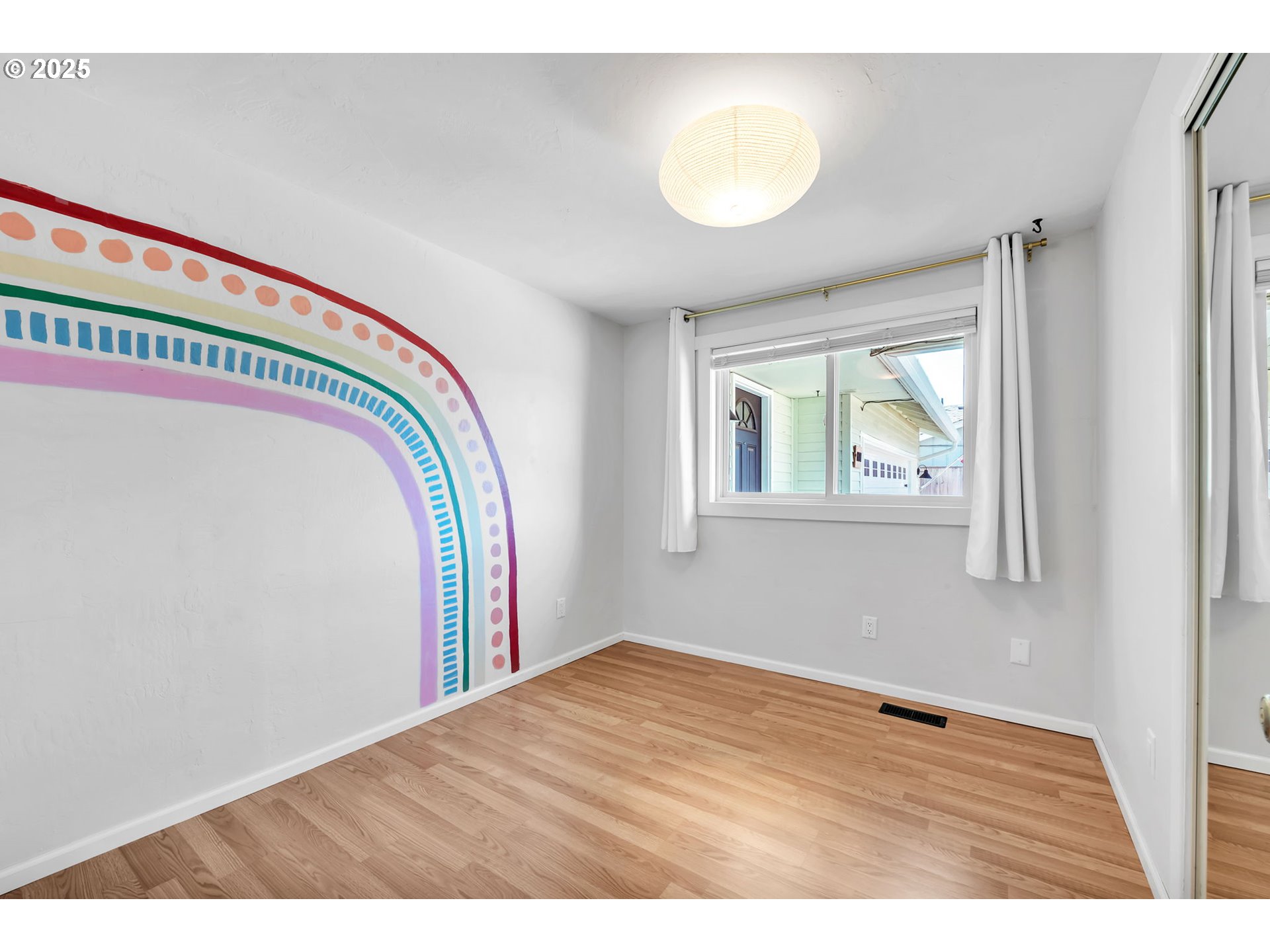 6781 F Street Springfield, OR 97478 - Photo 26 of 48 a view of an empty room with wooden floor and a window