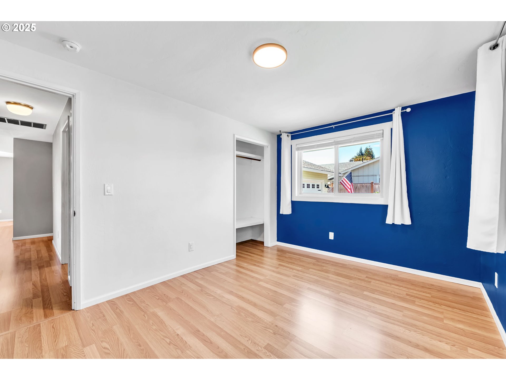 6781 F Street Springfield, OR 97478 - Photo 29 of 48 a view of an empty room with wooden floor