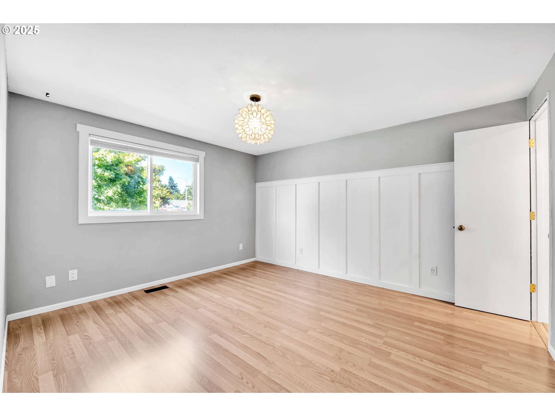 6781 F Street Springfield, OR 97478 - Photo 30 of 48 a view of an empty room with wooden floor and a window