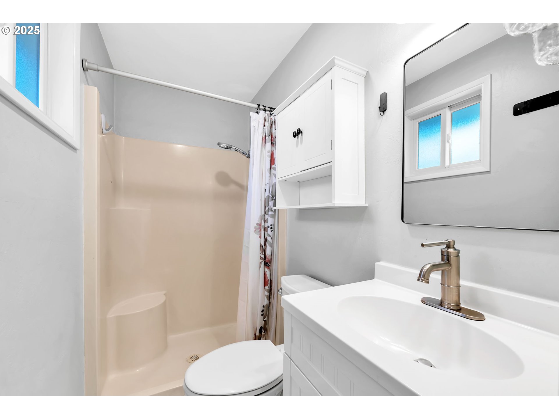 6781 F Street Springfield, OR 97478 - Photo 33 of 48 a bathroom with a sink toilet and shower