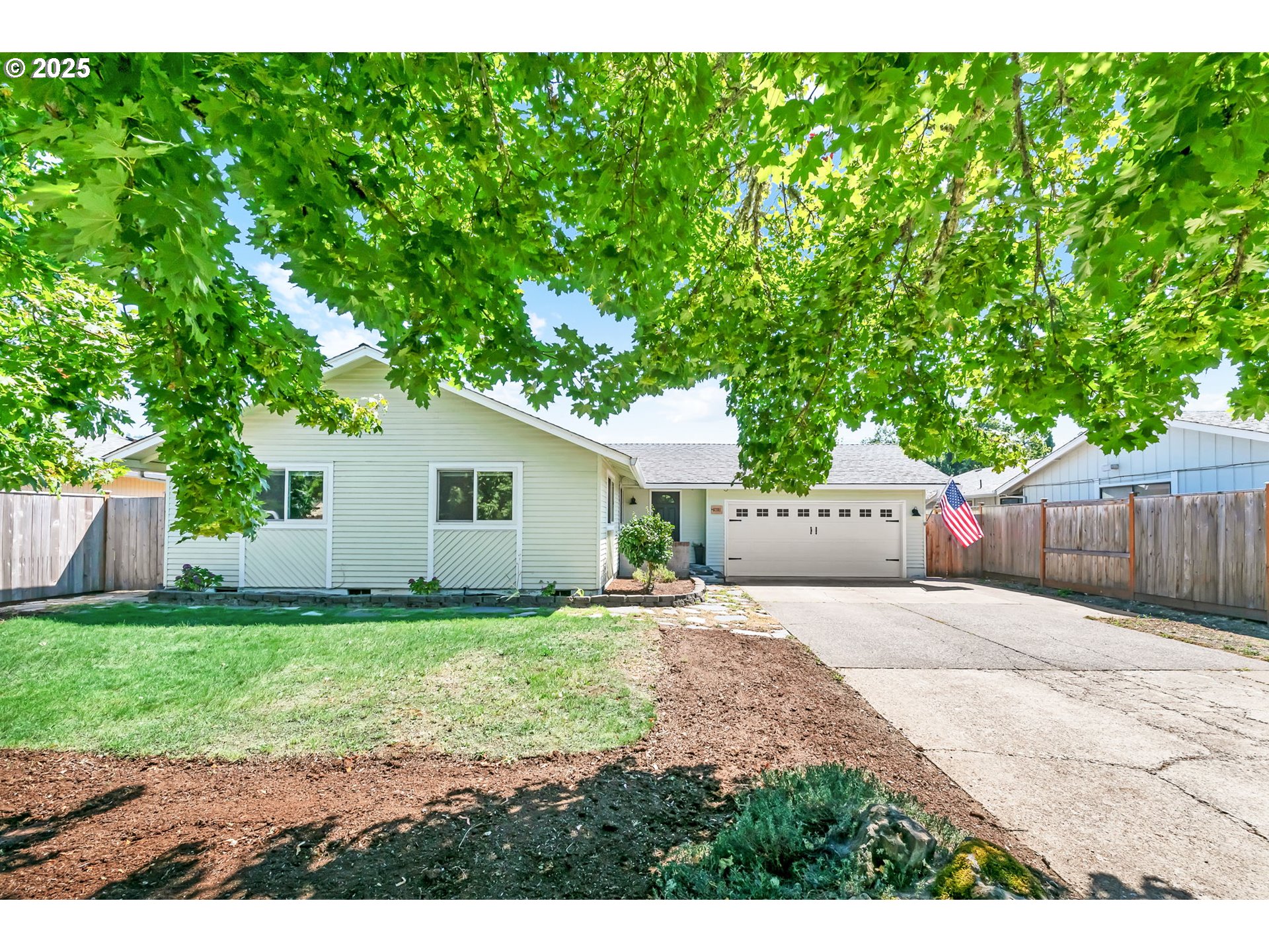 6781 F Street Springfield, OR 97478 - Photo 5 of 48 a house view with a garden space