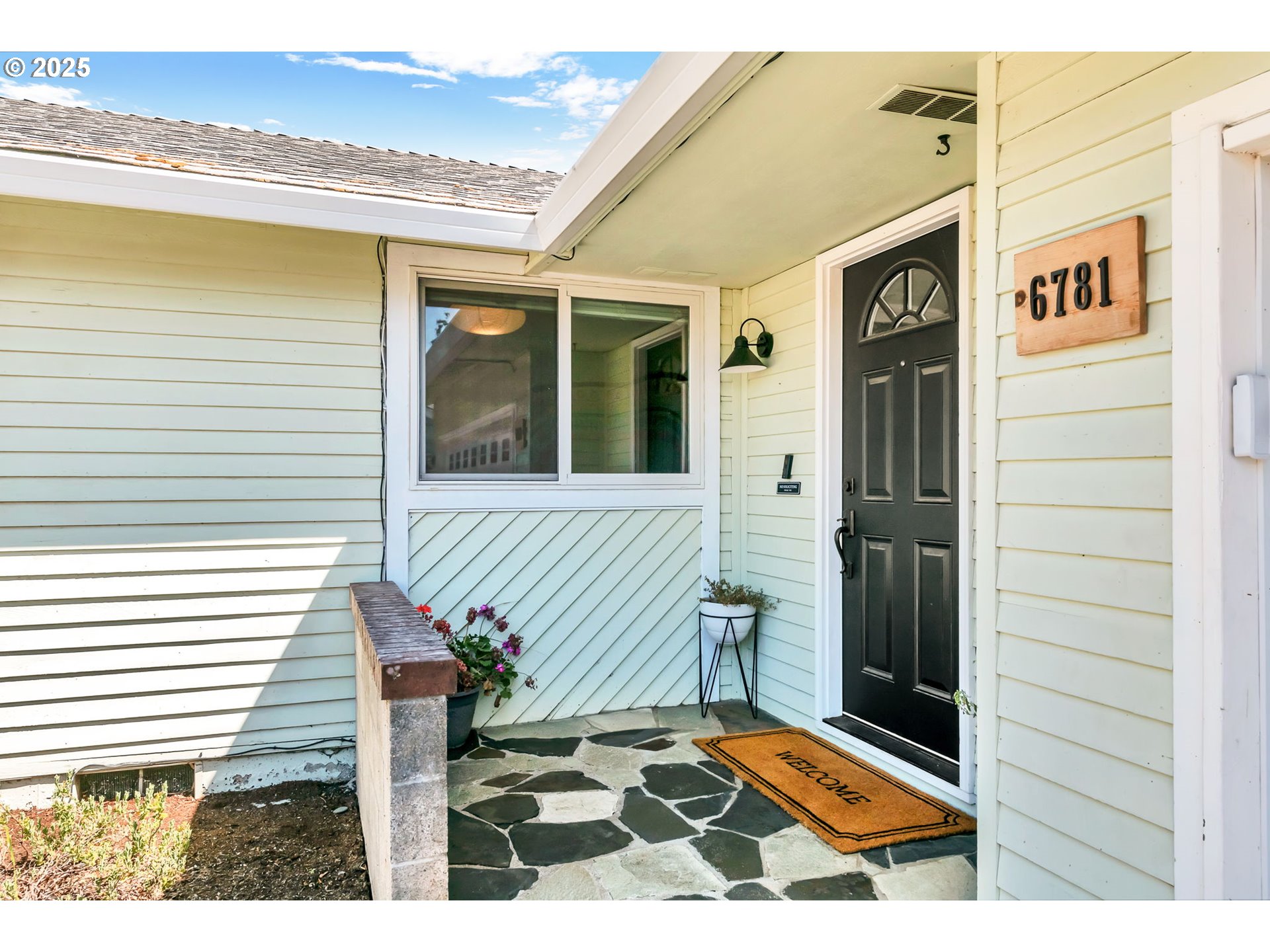 6781 F Street Springfield, OR 97478 - Photo 6 of 48 a view of front door of house with wooden floor