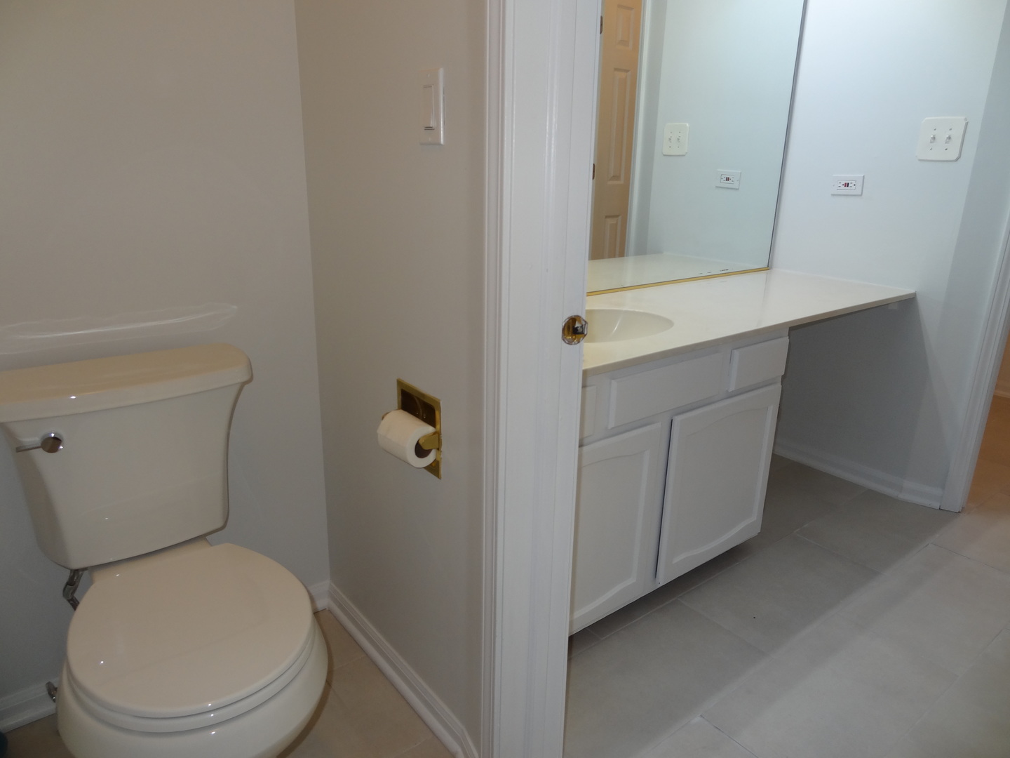 450 Bridle Trail, Unit 450 Wheeling, IL 60090 - Photo 11 of 15 a white toilet sitting next to a bathroom sink