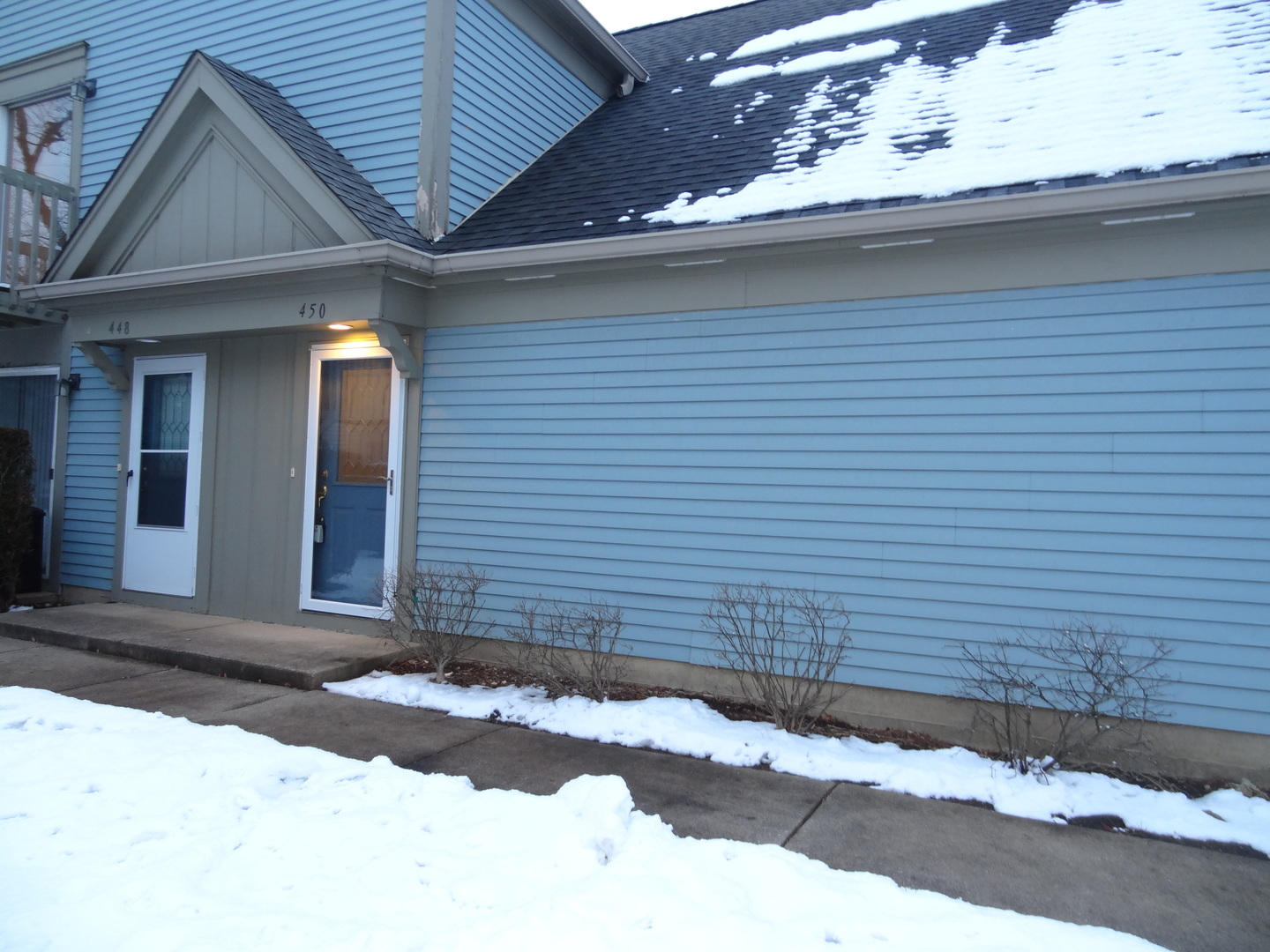 450 Bridle Trail, Unit 450 Wheeling, IL 60090 - Photo 15 of 15 a front view of a house with a yard