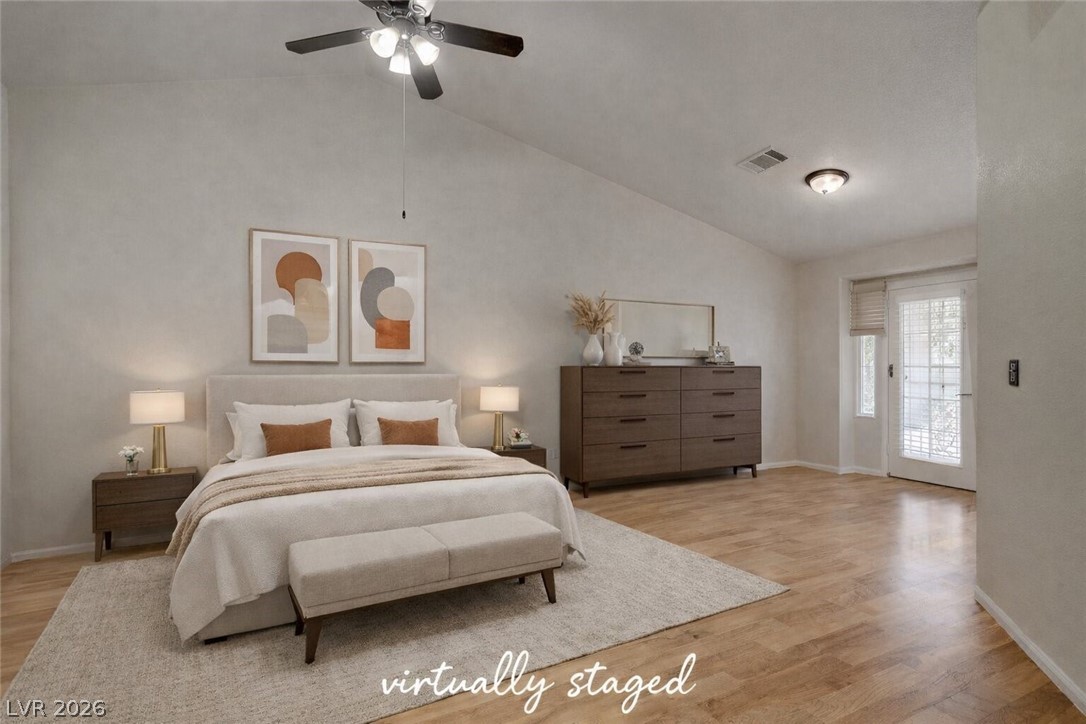 843 Rusty Anchor Way Henderson, NV 89002 - Photo 15 of 31 Bedroom featuring lofted ceiling, light wood-style floors, and a ceiling fan