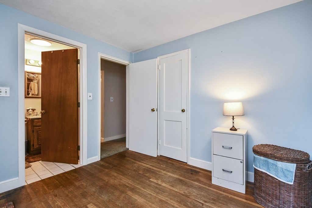 57 Davidson Road Framingham, MA 01701 - Photo 14 of 28 a bedroom with a bed and a dresser