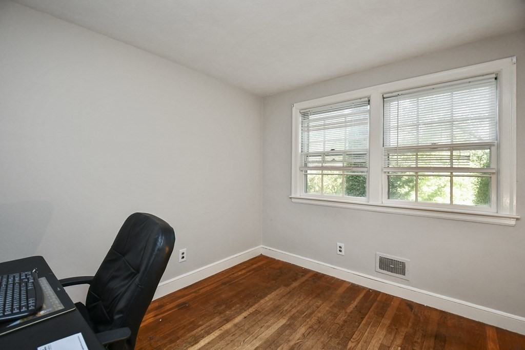 57 Davidson Road Framingham, MA 01701 - Photo 15 of 28 a view of a room with wooden floor and a window