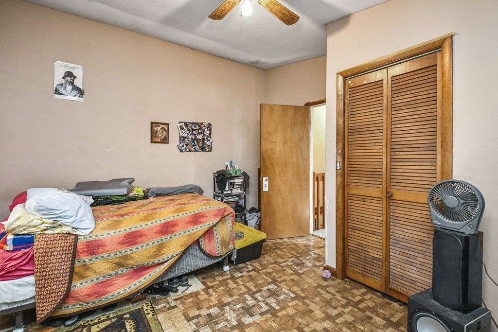 57 Davidson Road Framingham, MA 01701 - Photo 19 of 28 a bedroom with a bed and a chandelier