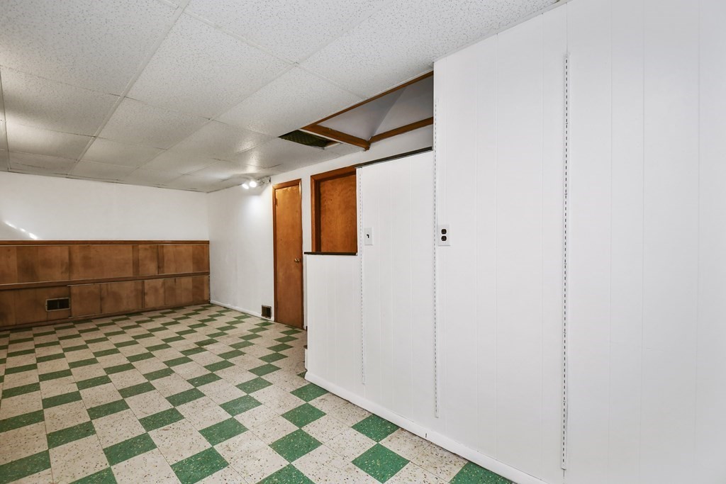 57 Davidson Road Framingham, MA 01701 - Photo 24 of 28 a room with a black white checkered floor