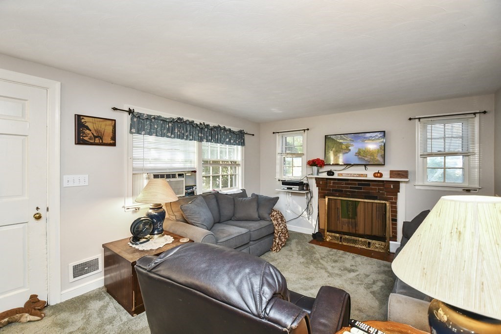 57 Davidson Road Framingham, MA 01701 - Photo 3 of 28 a living room with furniture stove and a window
