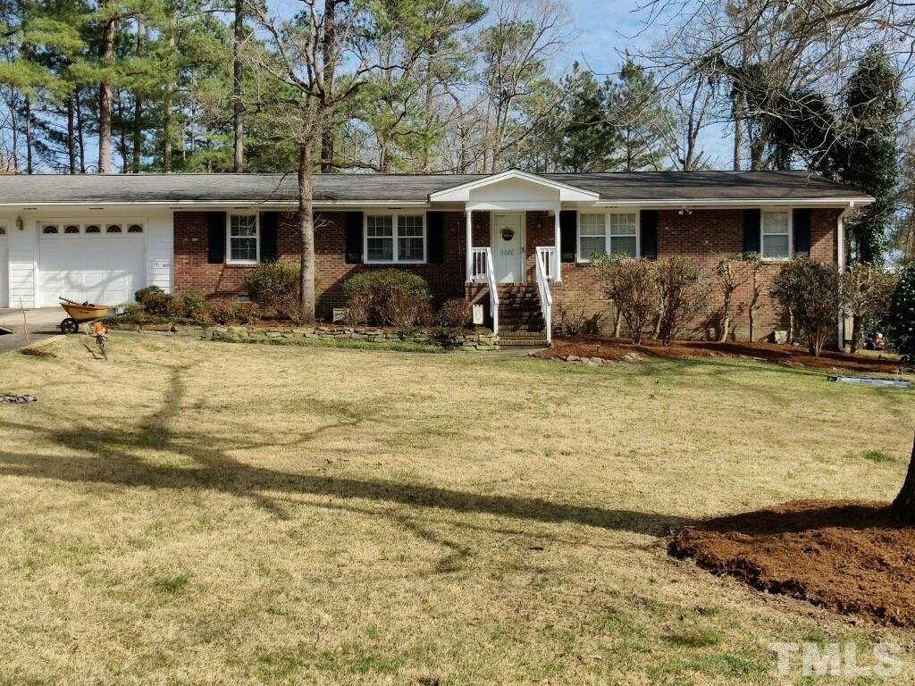 a view of a house with swimming pool and a porch