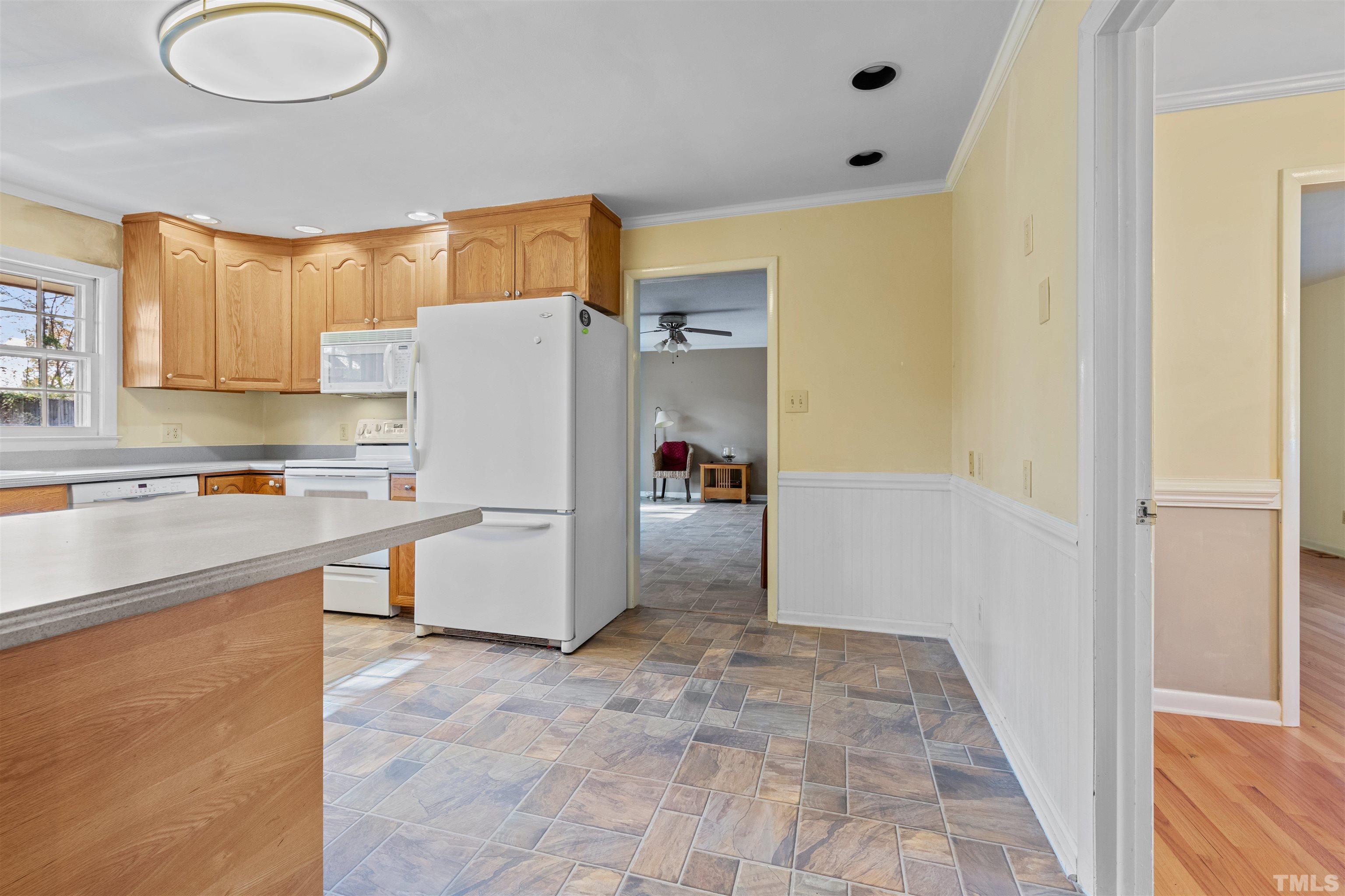 6000 Buffaloe Road Raleigh, NC 27616 - Photo 18 of 36 a kitchen with stainless steel appliances a refrigerator and a stove