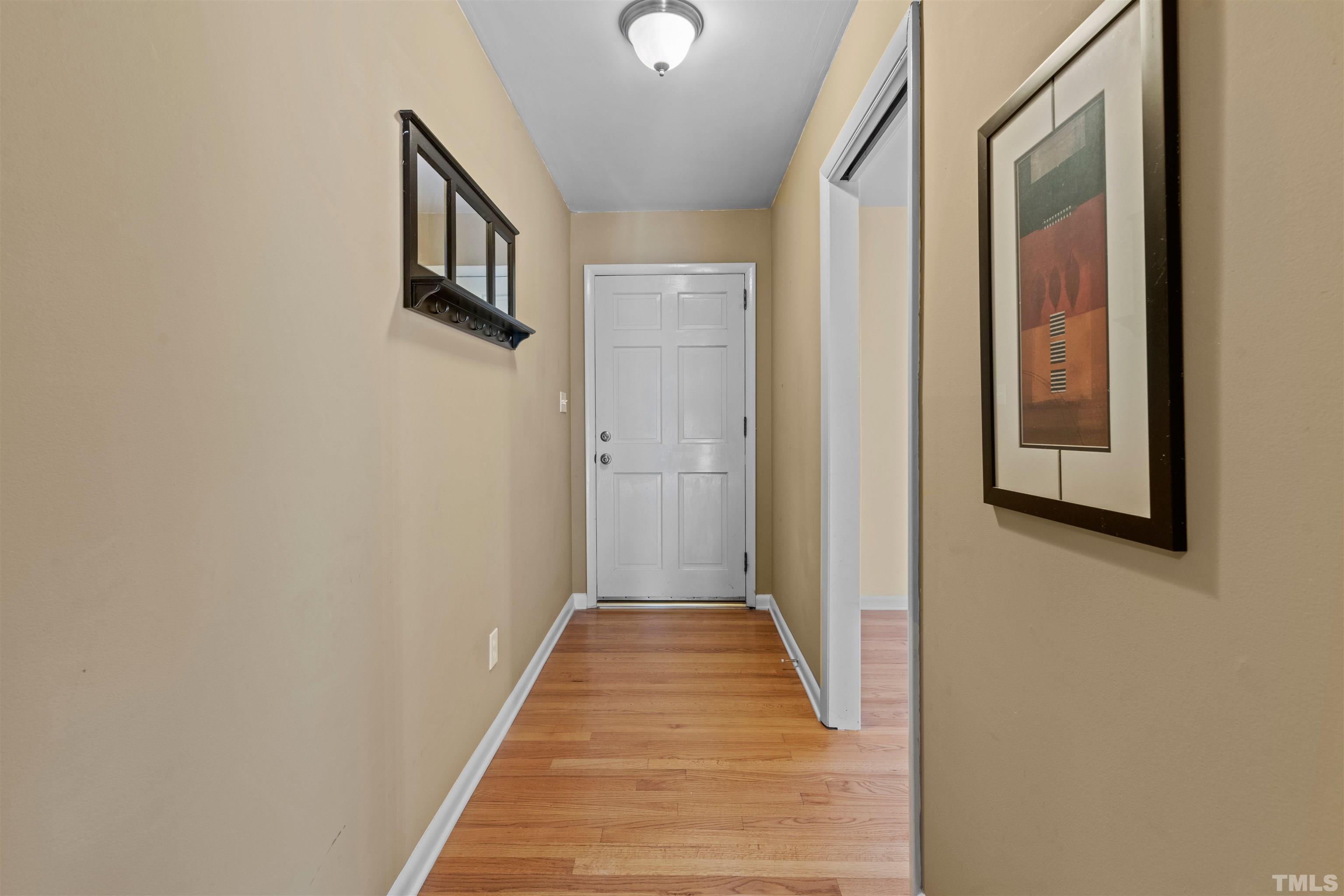 6000 Buffaloe Road Raleigh, NC 27616 - Photo 32 of 36 a view of a hallway with wooden floor and staircase