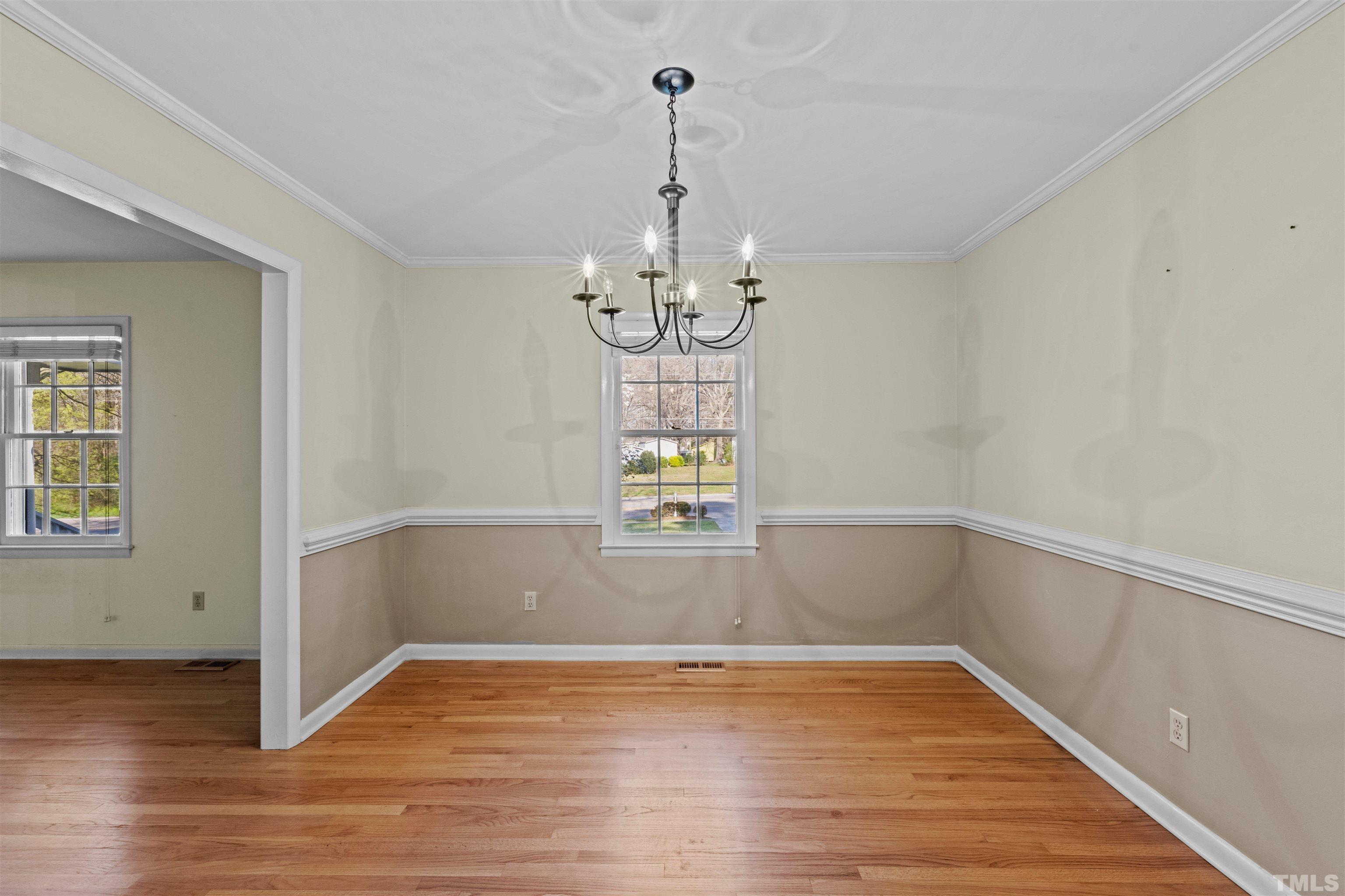 6000 Buffaloe Road Raleigh, NC 27616 - Photo 33 of 36 a view of a room with wooden floor and chandelier