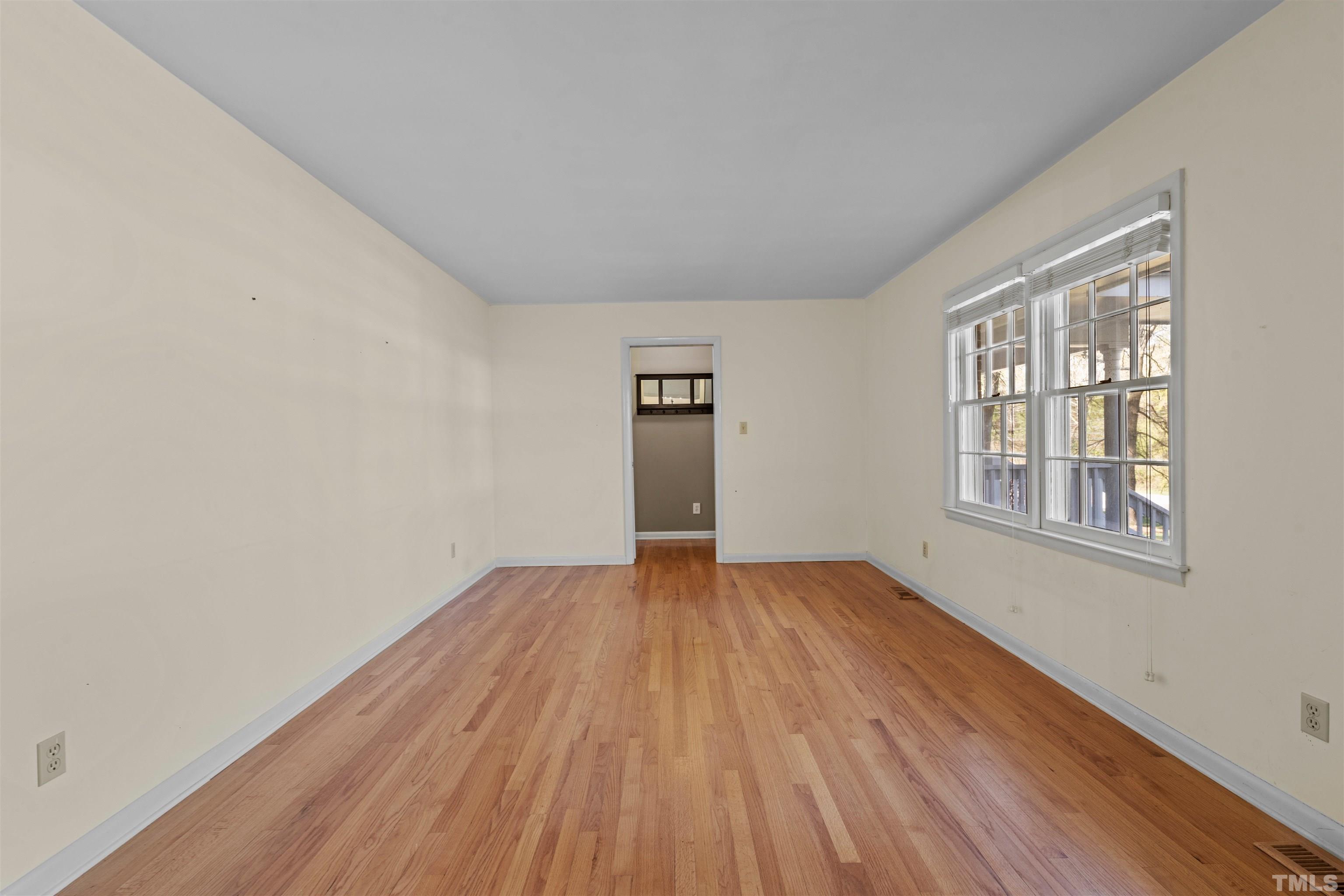 6000 Buffaloe Road Raleigh, NC 27616 - Photo 35 of 36 an empty room with wooden floor and windows