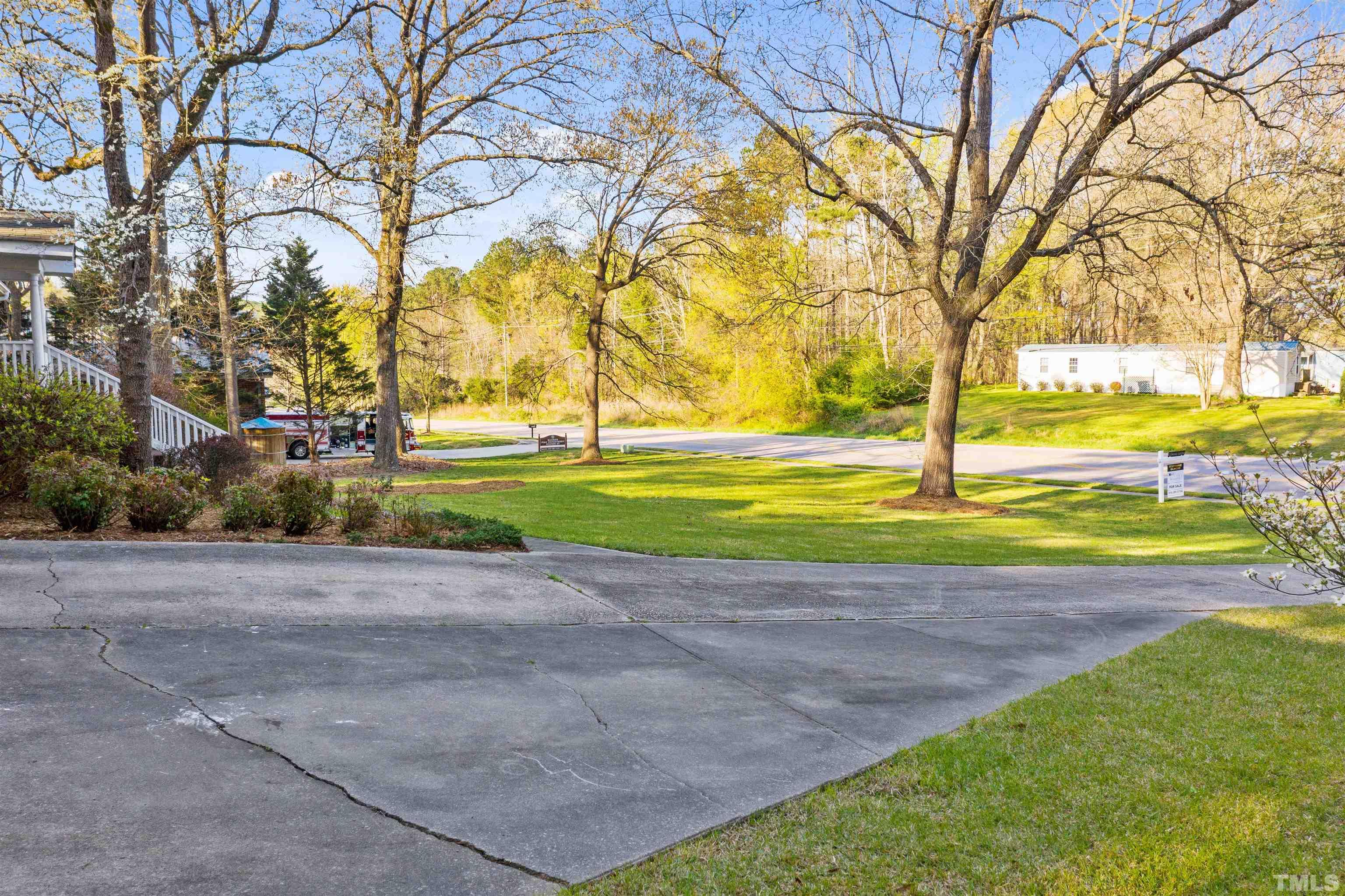 6000 Buffaloe Road Raleigh, NC 27616 - Photo 6 of 36 a view of a yard with a trees