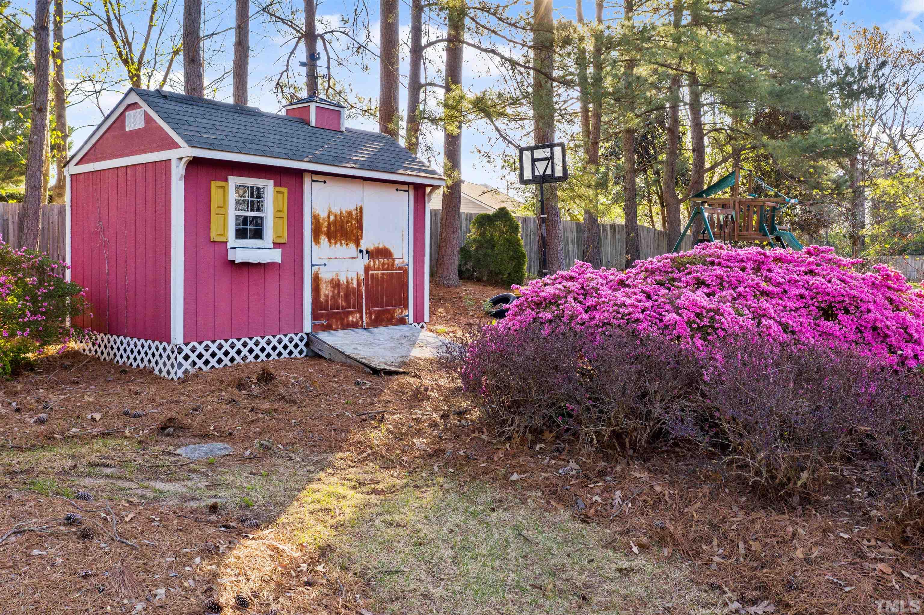 6000 Buffaloe Road Raleigh, NC 27616 - Photo 9 of 36 a view of a brick house with a yard