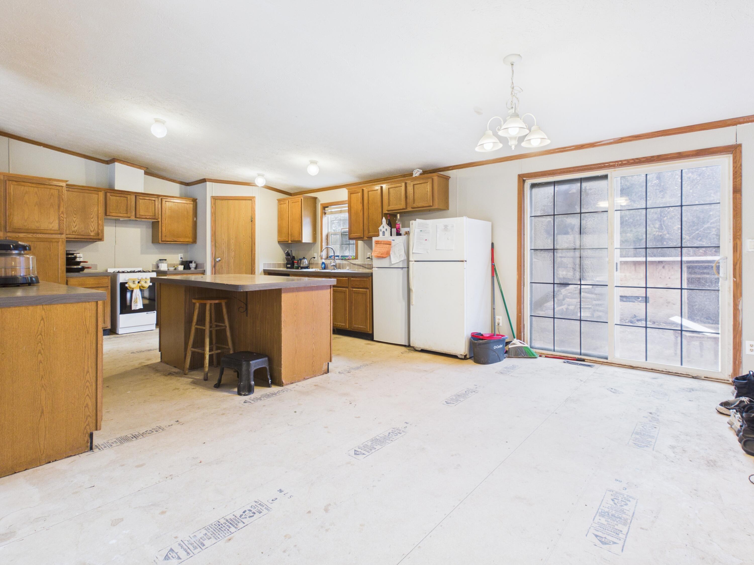 8541 South Grayling Road Grayling, MI 49738 - Photo 4 of 21 dining and kitchen flloring will be ins