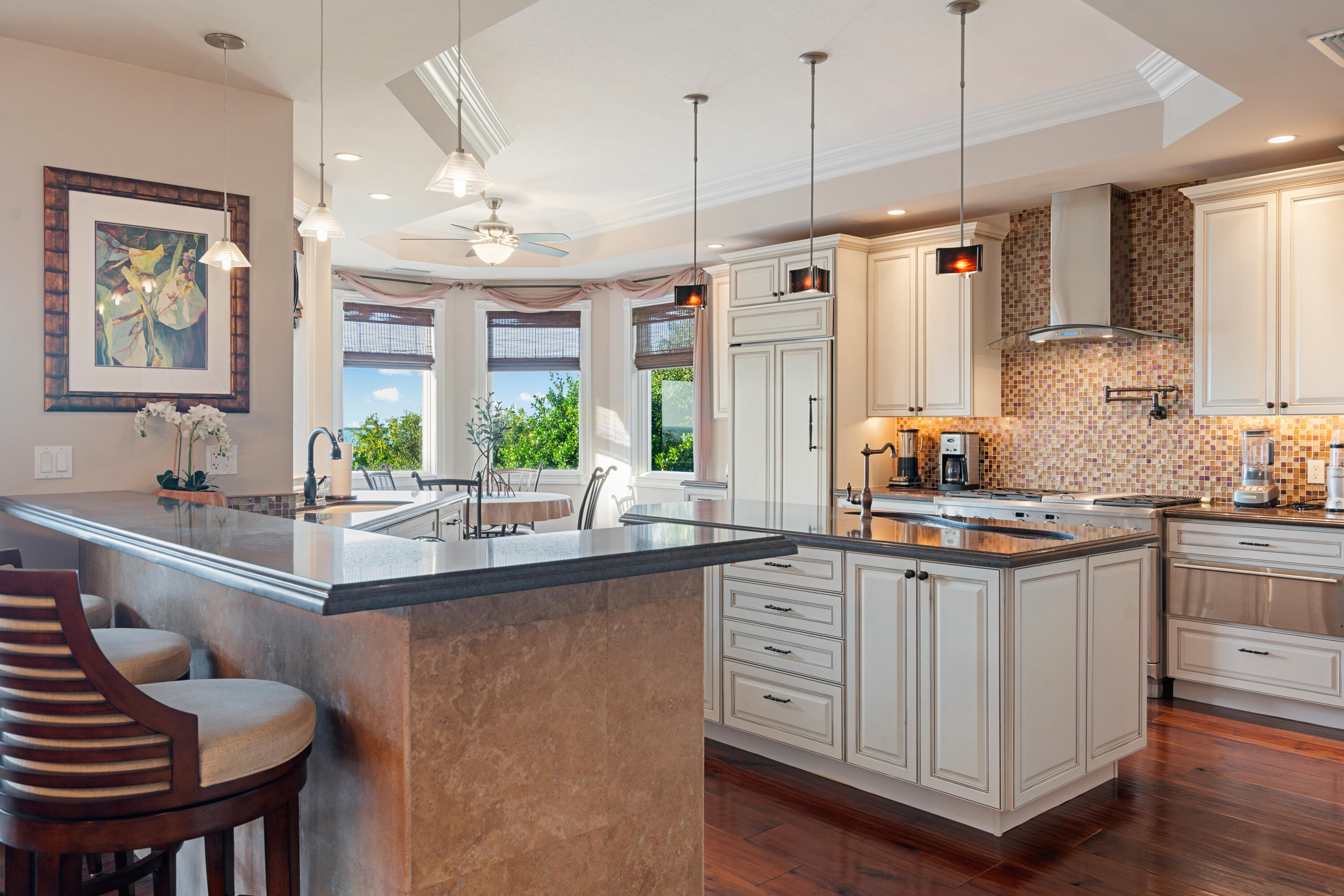 104 Coastal Drive Key Largo, FL 33037 - Photo 11 of 77 a kitchen with stainless steel appliances granite countertop a sink and a refrigerator