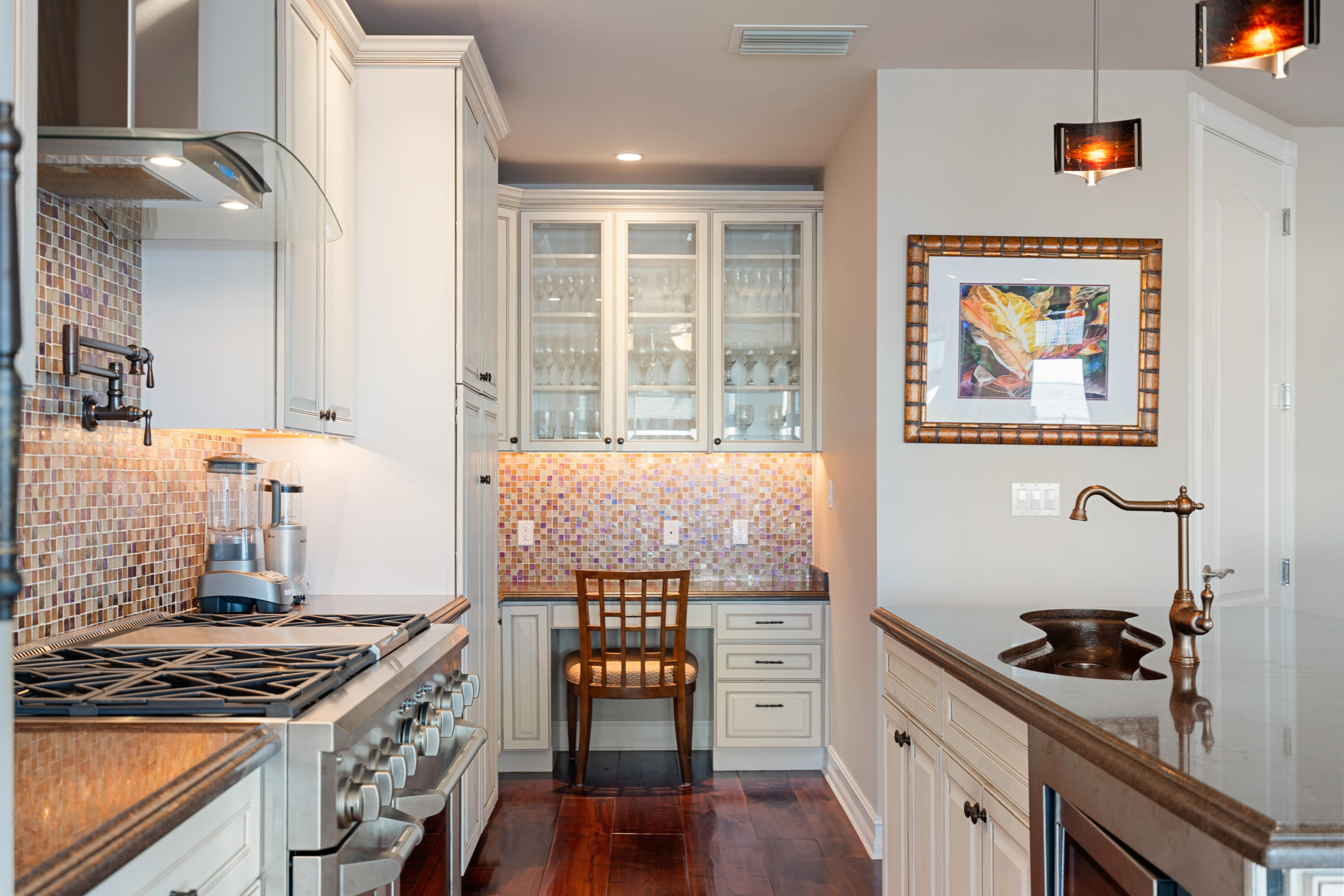 104 Coastal Drive Key Largo, FL 33037 - Photo 13 of 77 a kitchen with a stove and a wooden floor